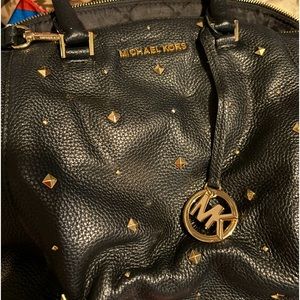 Black Leather Michel Kors  purse with silver studs. In great condition
